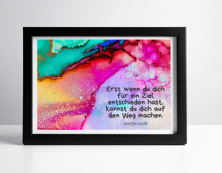Rahmen mit buntem, abstraktem Hintergrund und deutschem Zitat von Anton Saur, das die Entscheidung für ein Ziel und den Weg dorthin thematisiert.